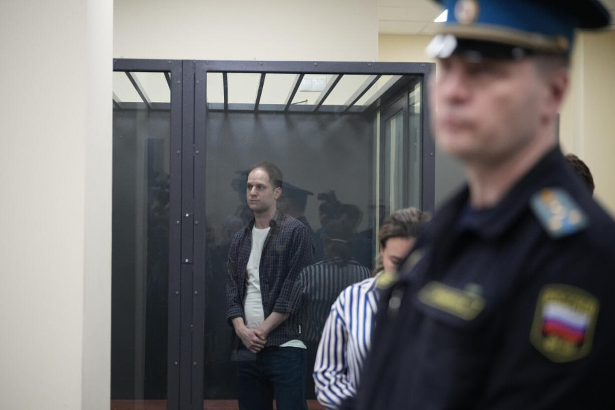 Wall Street Journal reporter Evan Gershkovich stands in a glass cage in a courtroom at the First Appeals Court of General Jurisdiction in Moscow, Russia, Tuesday, April 23, 2024. A court will considers an appeal against the arrest of WSJ reporter Evan Gershkovich who was detained on espionage charges in Yekaterinburg last year.
