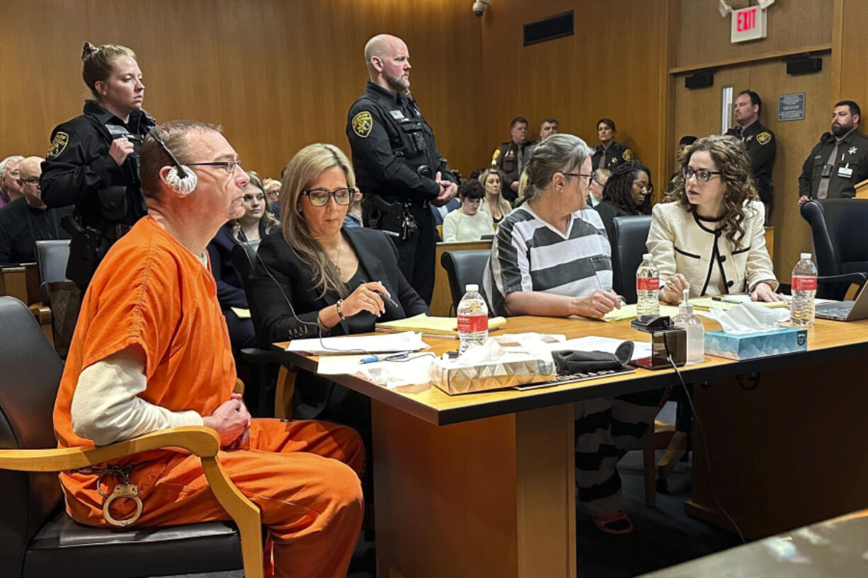 From left,  James Crumbley, defense lawyer Mariell Lehman, Jennifer Crumbley, and defense lawyer Shannon Smith await sentencing in Oakland County, Mich., court on Tuesday, April 9, 2024. The Crumbleys were convicted of involuntary manslaughter for a school shooting committed by their son in 2021.
