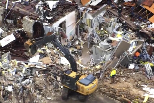 This image taken from video provided by KOCO shows a crew working on clearing debris caused by a tornado in Sulphur, Okla., Sunday, April 28, 2024.