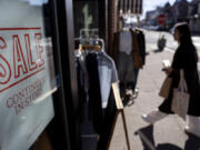 FILE - A shop holds a sidewalk sale on Feb. 10, 2023, in Providence, R.I.
