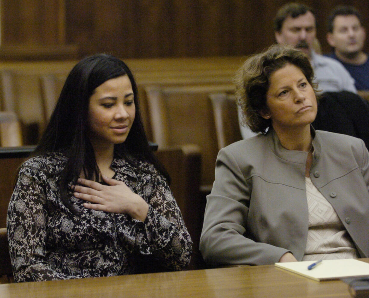 Sophia Johnson reacts in November 2005 to a jury acquitting her of first-degree murder in the death of her mother-in-law. Sitting next to her is Therese Lavallee, her lawyer, who won the retrial of her murder conviction.