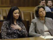 Sophia Johnson reacts in November 2005 to a jury acquitting her of first-degree murder in the death of her mother-in-law. Sitting next to her is Therese Lavallee, her lawyer, who won the retrial of her murder conviction.