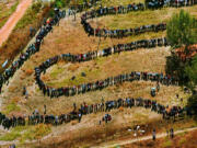 FILE - People queue to cast their votes In Soweto, South Africa April 27, 1994, in the country&rsquo;s first all-race elections. In 1994 people braved long queues to cast a vote after years of white minority rule which denied Black South Africans the vote. (AP Photo/Denis Farrell.