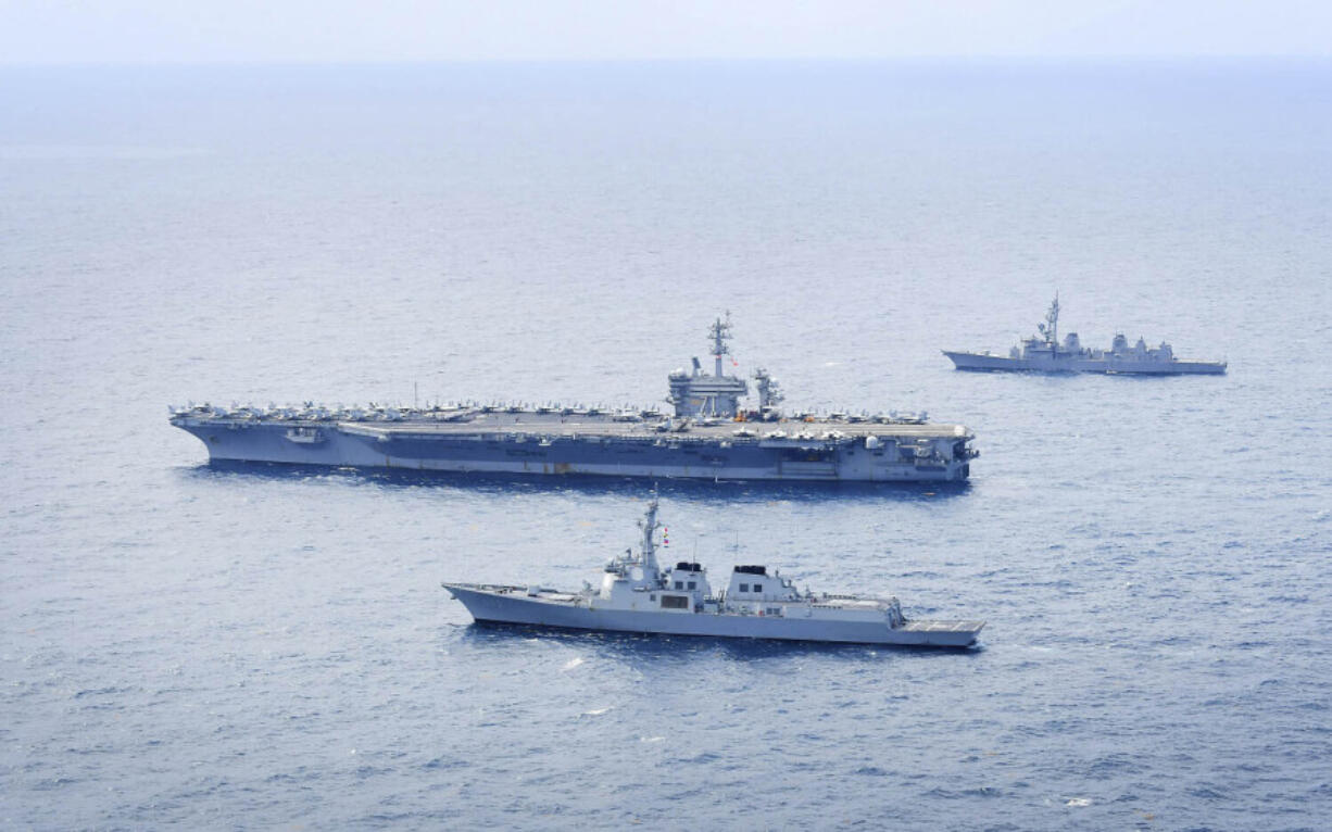 In this photo provided by South Korea&rsquo;s Defense Ministry, South Korean Navy&rsquo;s destroyer Seoae Ryu Sung-ryong, bottom, U.S. Navy&rsquo;s aircraft carrier Theodore Roosevelt, center, and Japan&rsquo;s Maritime Self-Defense Force&rsquo;s destroyer Ariake sail in formation during a joint naval exercise in international waters off South Korea&rsquo;s southern island of Jeju, Thursday, April 11, 2024.