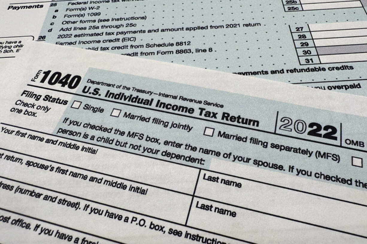 FILE - The Internal Revenue Service 1040 tax form for 2022 is seen on April 17, 2023. The IRS said Friday, April 26, 2024, more than 140,000 taxpayers filed their taxes through its new direct file pilot program. It says the program&#039;s users claimed more than $90 million in refunds, saving roughly $5.6 million in fees they would have spent with commercial tax preparation companies.