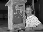 FILE - Walt Disney, creator of Mickey Mouse, poses at the Pancoast Hotel, Aug. 13, 1941, in Miami, Fla. Winnie the Pooh and Mickey Mouse have recently entered the public domain, making it possible for artists to use them freely.
