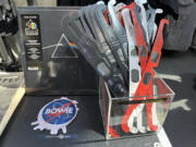 Eclipse glasses are for sale along with Pink Floyd&#039;s &quot;Dark Side of the Moon,&quot; album at the Rock Roll Hall of Fame in Cleveland, Sunday, April 7, 2024.