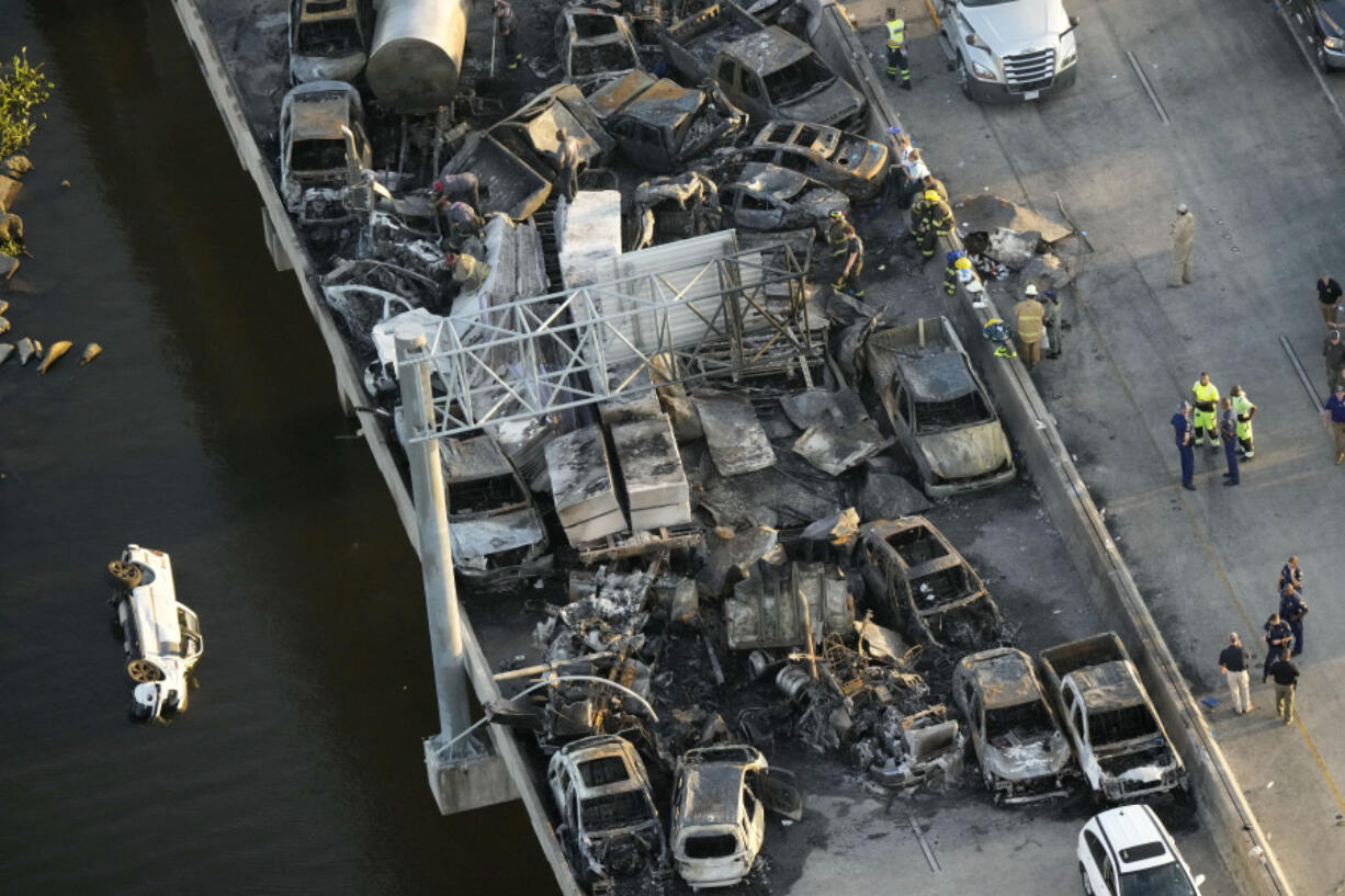FILE - In this aerial photo, responders are seen near wreckage in the aftermath of a fatal, multi-vehicle pileup on I-55 in Manchac, La., Oct. 23, 2023. The National HIghway Traffic Safety Administration will release its estimate of traffic deaths for 2023 on Monday, April 1, 2024.