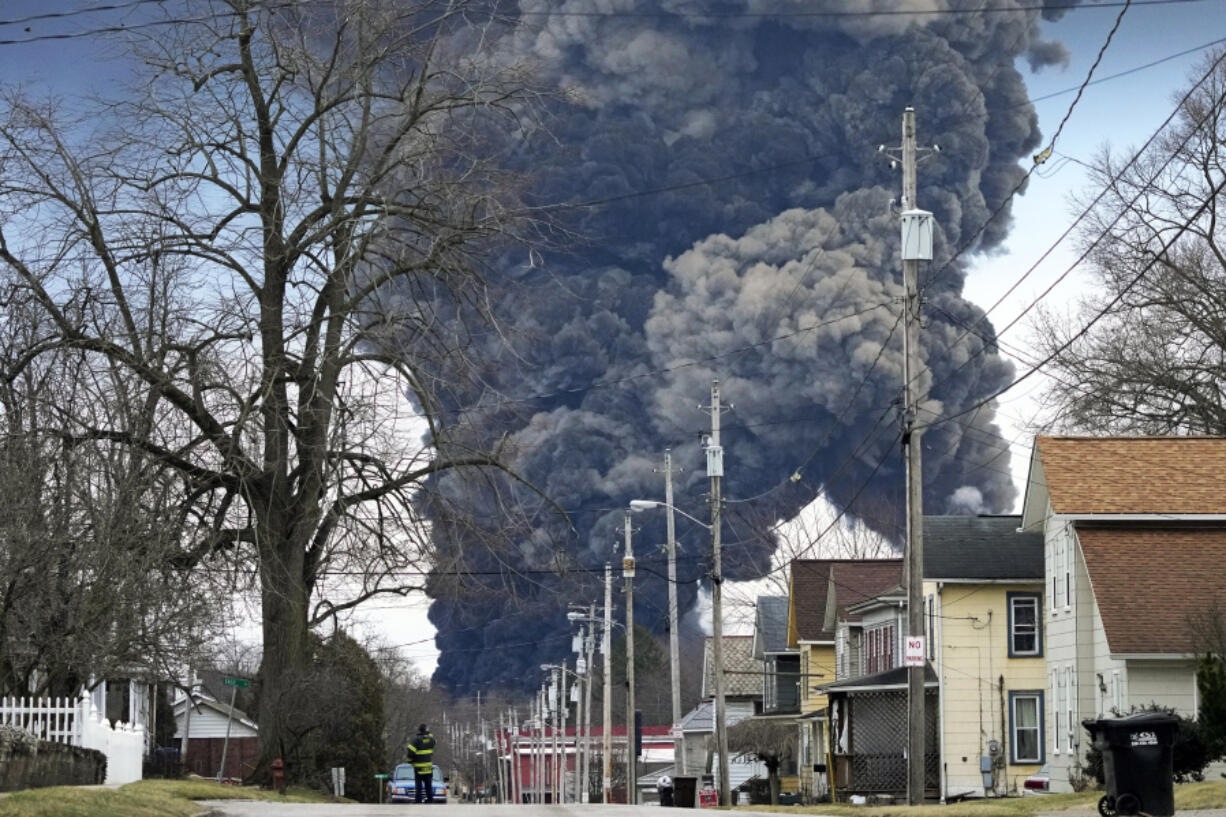 FILE - A black plume rises over East Palestine, Ohio, as a result of the controlled detonation of a portion of the derailed Norfolk Southern trains Monday, Feb. 6, 2023.  On Tuesday, April 9, 2024, Norfolk Southern has agreed to pay $600 million in a class-action lawsuit settlement related to a fiery train derailment in February 2023 in eastern Ohio.  (AP Photo/Gene J.