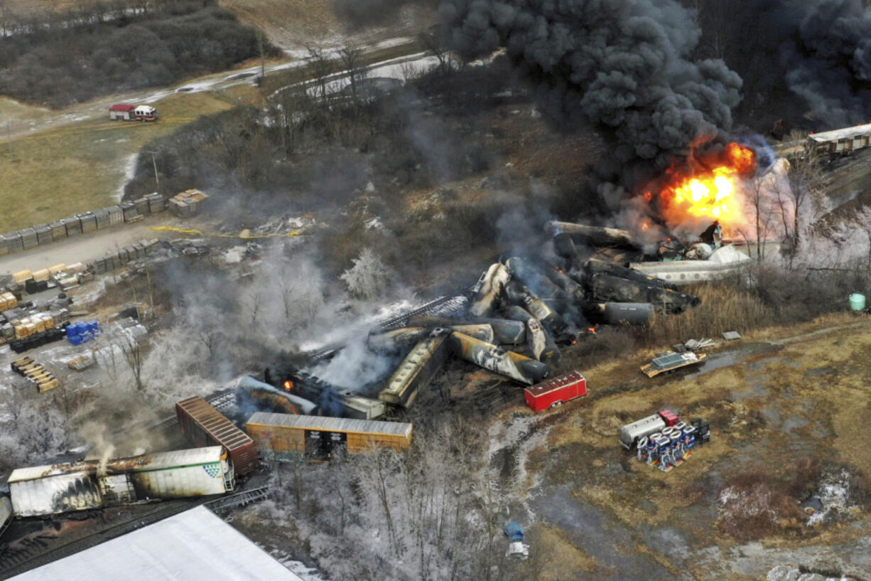 FILE - Debris from a Norfolk Southern freight train lies scattered and burning along the tracks on Feb. 4, 2023, the day after it derailed in East Palestine, Ohio. (AP Photo/Gene J.