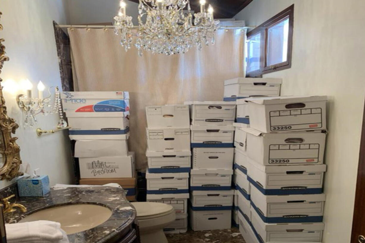 This image, contained in the indictment against former President Donald Trump, shows boxes of records stored in a bathroom and shower in the Lake Room at Trump&#039;s Mar-a-Lago estate in Palm Beach, Fla. The classified documents investigation of Donald Trump appeared to have clear momentum in 2022 when FBI agents who searched the former president&rsquo;s Mar-a-Lago estate recovered dozens of boxes containing sensitive documents. But each passing day brings mounting doubts that the case can reach trial this year. The judge has yet to set a firm trial date despite holding two hours-long hearings with lawyers this month.