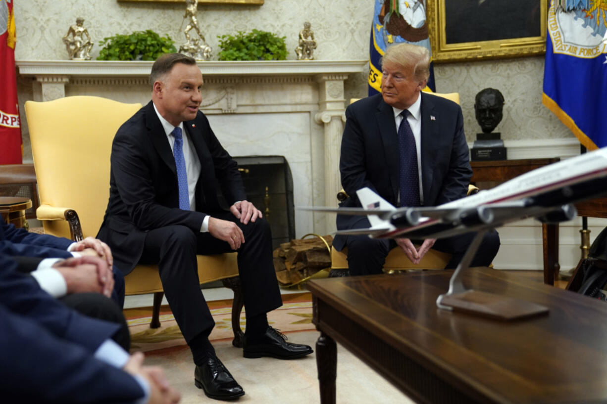 FILE - President Donald Trump meets with Polish President Andrzej Duda in the Oval Office of the White House, June 24, 2020, in Washington. Trump is set to meet with Polish President Andrzej Duda in New York as Trump&rsquo;s criminal trial takes a one-day break. Their planned dinner Wednesday comes as European leaders prepare for the possibility Trump might win the White House in November.
