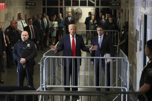Republican presidential candidate and former President Donald Trump talks to reporters at Manhattan state court in New York, Monday, April 23, 2024.