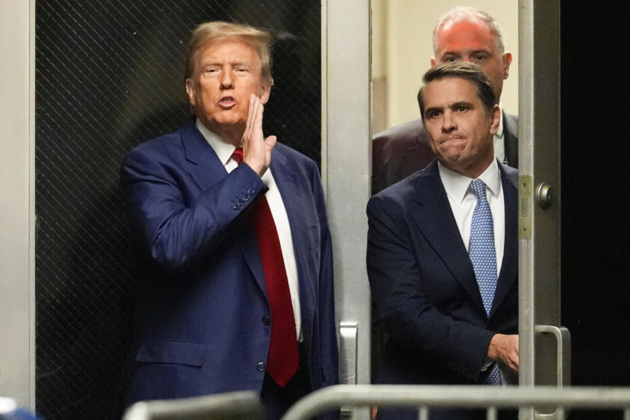 FILE - Former President Donald Trump comments as he leaves a pre-trial hearing during a recess with his defense team at Manhattan criminal, Monday, March 25, 2024, in New York. The first-ever trial of a former U.S. president will feature allegations that Trump falsified business records while compensating one of his lawyers, Michael Cohen, for burying stories about extramarital affairs that arose during the 2016 presidential race.