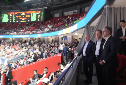 U.S. Secretary of State Antony Blinken talks with U.S. Ambassador to China Nicholas Burns, center, with U.S. Consulate General in Shanghai Scott Walker, left, while attending a basketball game between the Shanghai Sharks and the Zhejiang Golden Bulls at the Shanghai Indoor Stadium, Wednesday, April 24, 2024, in Shanghai, China.