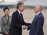 U.S. Secretary of State Antony Blinken, center, shakes hands with Scott Walker, Consul General at the U.S Consulate General in Shanghai, as Blinken prepares to depart, Thursday, April 25, 2024, from the Shanghai Hongqiao International Airport in Shanghai, China, en route to Beijing.