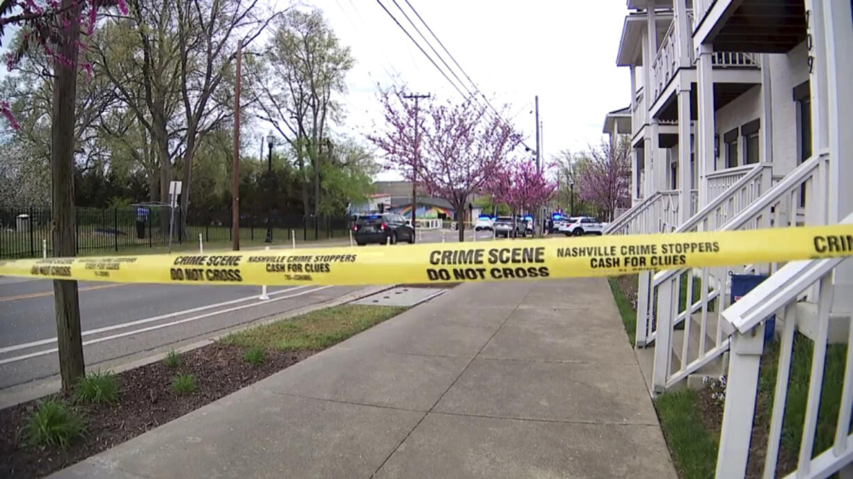 This image made from video shows the crime scene tape across street after a fatal shooting in Nashville, Sunday, March 31, 2024. A man was killed and five other people were injured during a shooting inside a Nashville, Tennessee, restaurant on Sunday afternoon, police said.