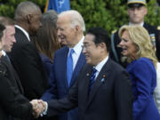 White House national security adviser Jake Sullivan, from third left, and Defense Secretary Lloyd Austin greet President Joe Biden and Japan&#039;s Prime Minister Fumio Kishida as first lady Jill Biden looks on during a State Arrival Ceremony on the South Lawn of the White House, Wednesday, April 10, 2024, in Washington.