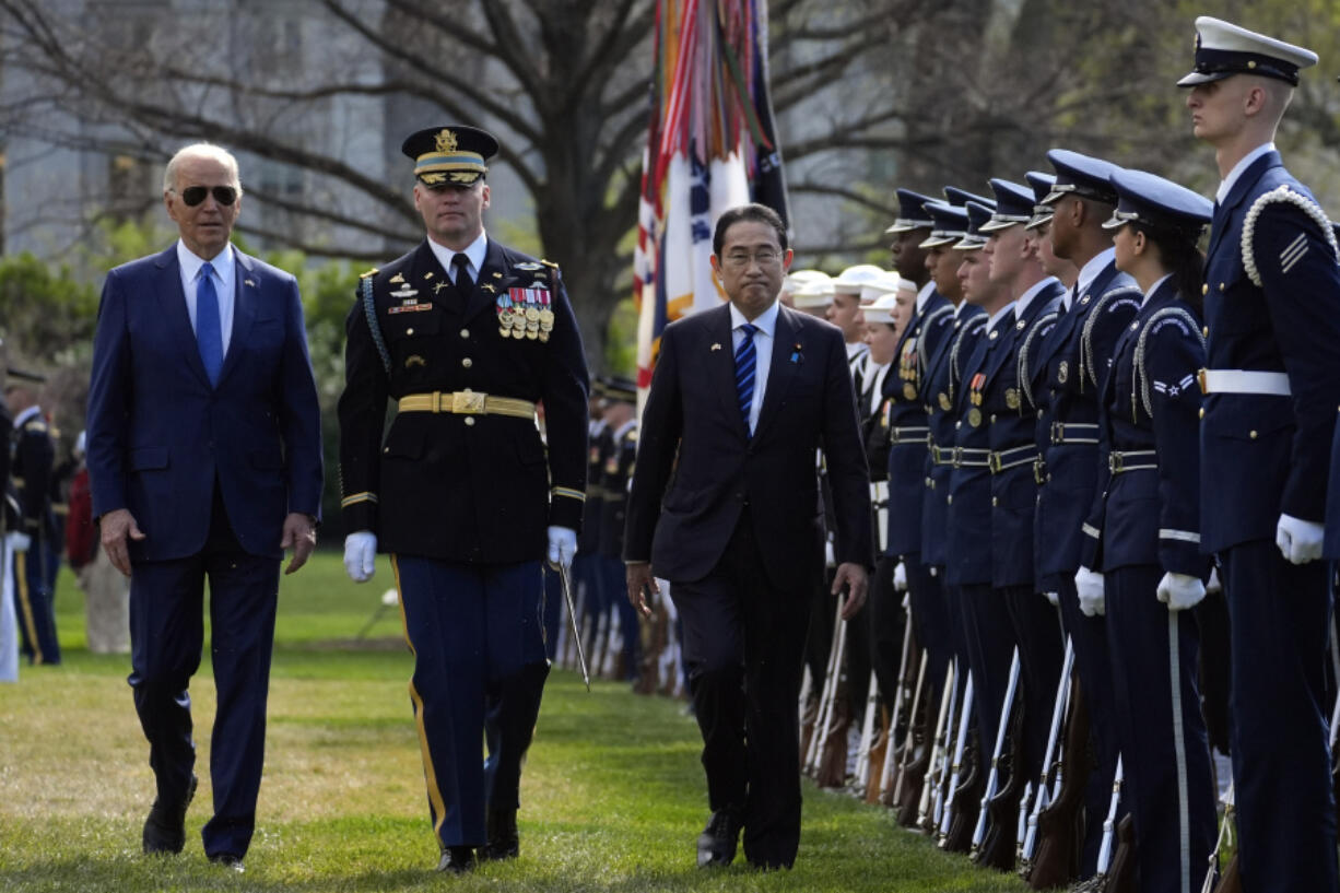 President Joe Biden and Japanese Prime Minister Fumio Kishida review the troops with Col. David Rowland, commander of the 3rd U.S. Infantry Regiment, The Old Guard, during a State Arrival Ceremony on the South Lawn of the White House, Wednesday, April 10, 2024, in Washington.