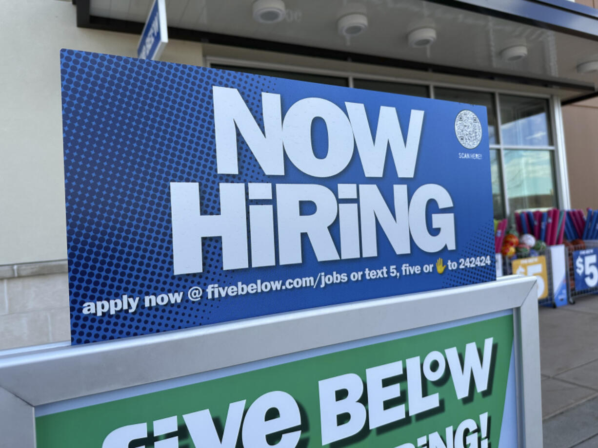 A hiring sign beckons potential employees to apply for work inside a discount store Wednesday, April 3, 2024, in Centennial, Colo. On Thursday, April 11, 2024, the Labor Department reports on the number of people who applied for unemployment benefits last week.