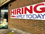 A hiring sign is displayed in Riverwoods, Ill., Tuesday, April 16, 2024. On Thursday, April 18, 2024, the Labor Department reports on the number of people who applied for unemployment benefits last week. (AP Photo/Nam Y.