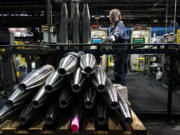 FILE -A steel worker moves a 155 mm M795 artillery projectile during the manufacturing process at the Scranton Army Ammunition Plant in Scranton, Pa., Thursday, April 13, 2023. The Pentagon could get weapons moving to Ukraine within days if Congress passes a long-delayed aid bill. That&rsquo;s because it has a network of storage sites in the U.S. and Europe that already hold the ammunition and air defense components that Kyiv desperately needs. Moving fast is critical, CIA Director Bill Burns said Thursday, April 18, 2024.