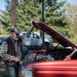 James Turner opens the hood of his truck Wednesday at Vancouver Kiggins Village Safe Stay shelter. He used to sleep in the truck, but now he’s moving into housing. (Taylor Balkom/The Columbian)