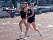Daphne Evenson of Skyview (right) celebrates as she beats Eliisa Marshall of Camas to the finish line of the 4A girls 800 meters at the 4A/3A Greater St. Helens League district track and field meet at McKenzie Stadium on Thursday, May 9, 2024.