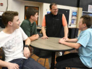Washougal School District Assistant Superintendent Aaron Hansen chats with students Monday.