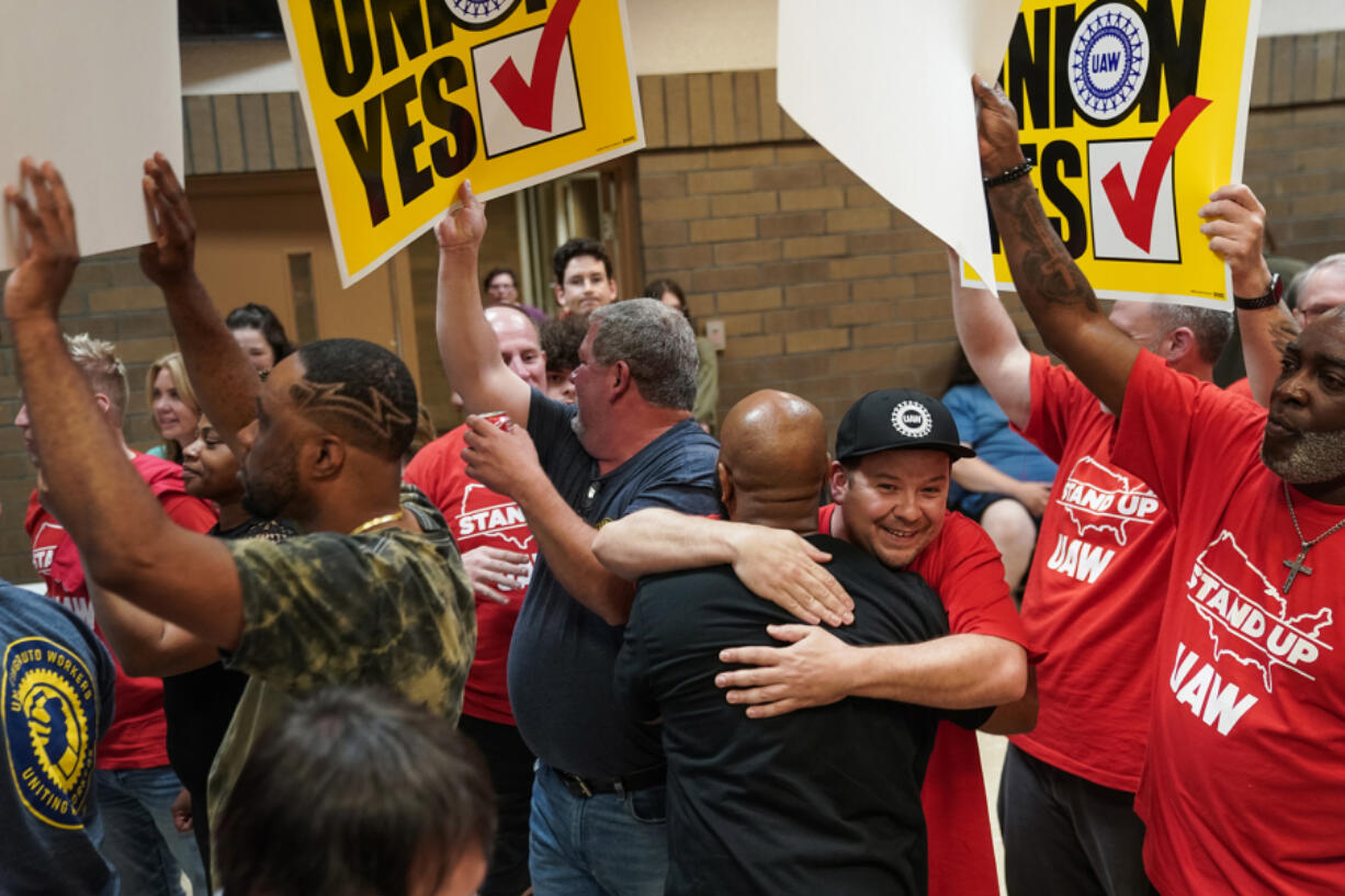 People celebrate after the United Auto Workers (UAW) received enough votes to form a union at a UAW vote watch party on April 19, 2024, in Chattanooga, Tennessee.