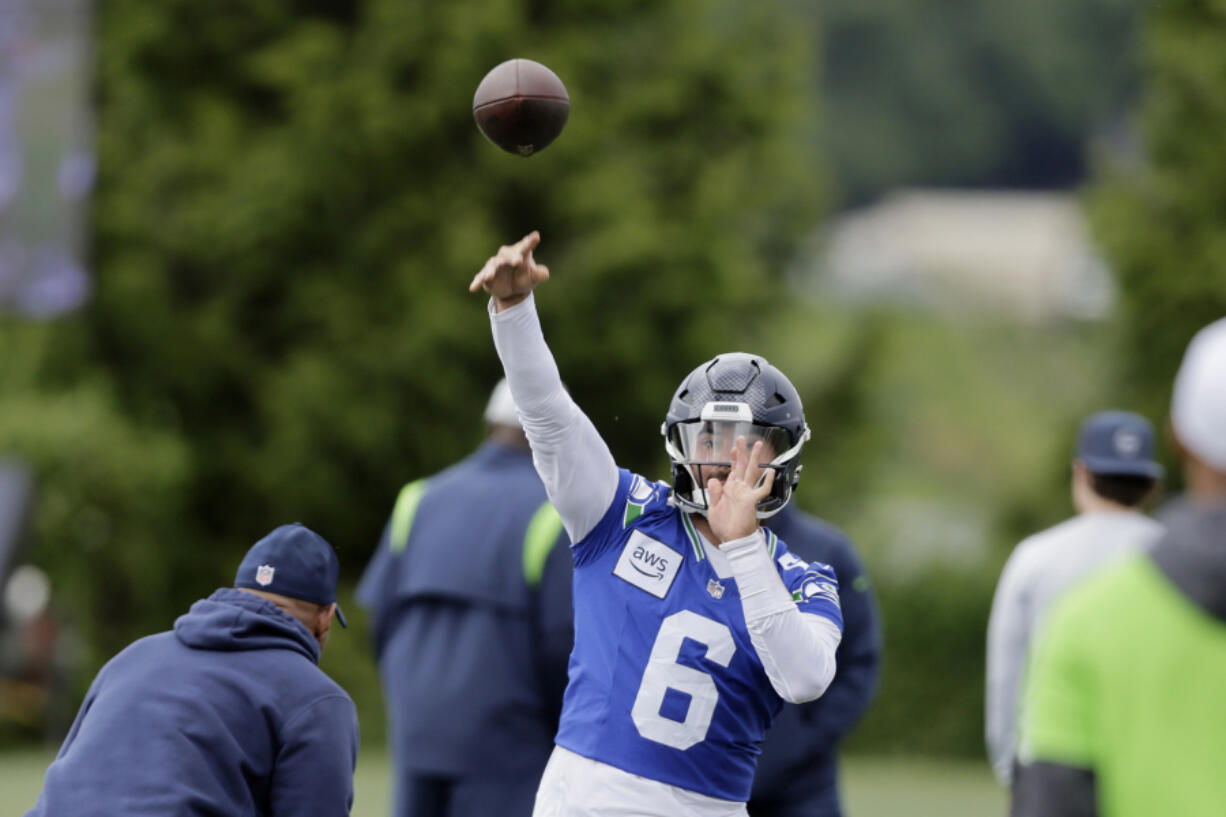 Seattle Seahawks quarterback Sam Howell makes a pass during an NFL football practice, Wednesday, May 22, 2024, in Renton, Wash.