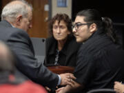 Defense attorneys Ed Dunkerly, from left, and Michele Michalek meet with defendant Julio Segura before opening statements Monday morning in his murder trial for the 2022 death of Vancouver police Officer Donald Sahota at the Clark County Courthouse.