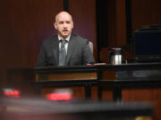 Clark County sheriff&rsquo;s Deputy Jonathan Feller testifies on the witness stand Wednesday during the murder trial of Julio Segura at the Clark County Courthouse. Segura is facing a host of charges including multiple counts of murder, kidnapping, burglary, robbery and others, in the death of off-duty Vancouver police Officer Donald Sahota in January 2022. Feller mistakenly fatally shot Sahota when he arrived to the scene of a struggle between Segura and Sahota.