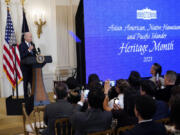 FILE - President Joe Biden speaks before a screening of the series &ldquo;American Born Chinese&rdquo; in the East Room of the White House in Washington, in celebration of Asian American, Native Hawaiian, and Pacific Islander Heritage Month, May 8, 2023. It has been almost 50 years since the U.S. government established that Asian Americans, Native Hawaiians and Pacific Islanders and their accomplishments should be recognized annually across the nation.