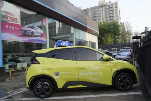 A Seagull electric vehicle from Chinese automaker BYD for test driving is parked outside a showroom in Beijing, Wednesday, April 10, 2024. The tiny, low-priced electric vehicle called the Seagull has American automakers and politicians trembling. The car, launched last year by Chinese automaker BYD, sells for around $12,000 in China. But it drives well and is put together with craftsmanship that rivals U.S.-made electric vehicles that cost three times as much.