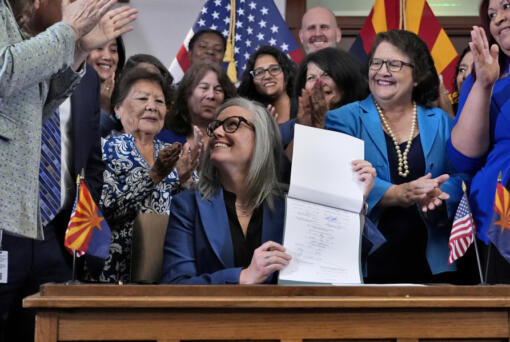 Arizona Gov. Katie Hobbs smiles after signing the repeal of the Civil War-era near-total abortion ban, Thursday, May 2, 2024, at the Capitol in Phoenix. Democrats secured enough votes in the Arizona Senate to repeal the ban on abortions that the state&rsquo;s highest court recently allowed to take effect.