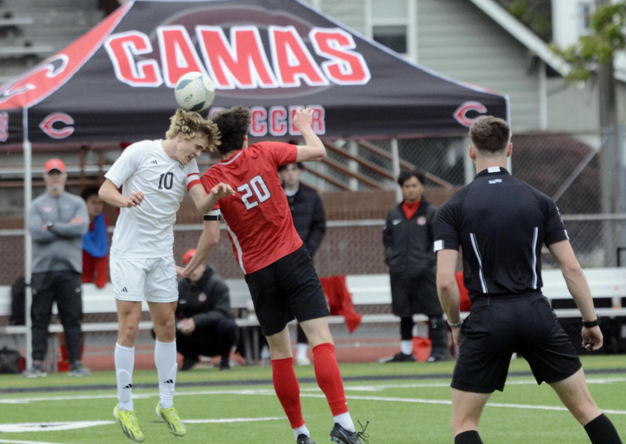 Mount Si's Zach Ramsey (10) and Camas' Owen Tuttle (20) go up to head the ball during the Class 4A boys soccer state championship game on Saturday, May 25, 2024, at Sparks Stadium in Puyallup.