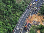 In this photo released by Xinhua News Agency, an aerial photo shows rescuers work at the site of a collapsed road section of the Meizhou-Dabu Expressway in Meizhou, south China&rsquo;s Guangdong Province, Wednesday, May 1, 2024. A section of a highway collapsed early Wednesday in southern China leaving more than a dozen of people dead, local officials said, after the area had experienced heavy rain in recent days.