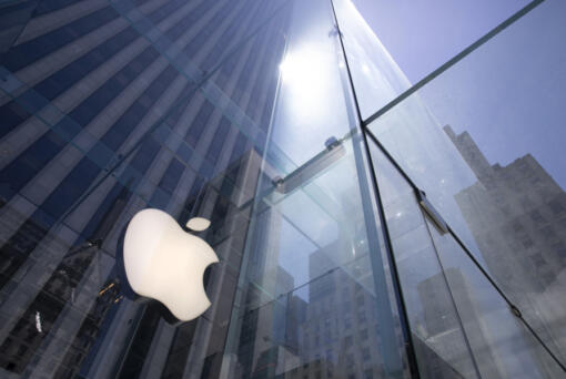 FILE - In this June 16, 2020 file photo, the sun is reflected on Apple&#039;s Fifth Avenue store in New York. Apple will reports earnings on Thursday May 2, 2024.