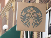 FILE - Starbucks sign hangs outside a casino along Main Street Wednesday, Sept. 20, 2023, in Deadwood, S.D. Starbucks will reports earnings on Tuesday, April 30, 2024.