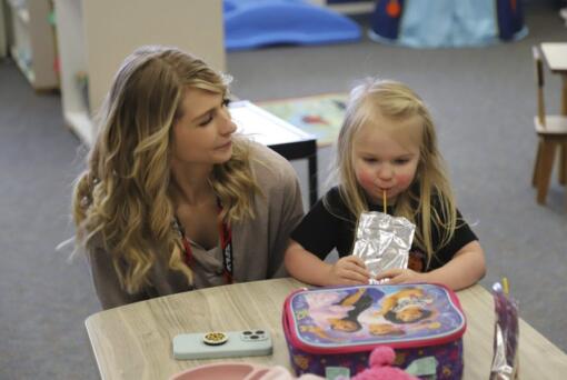 Second grade teacher Ashlie Monroe stops in at Endeavor Elementary&rsquo;s on-site day care Feb.