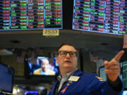 Traders work on the floor at the New York Stock Exchange in New York, Wednesday, May 1, 2024.