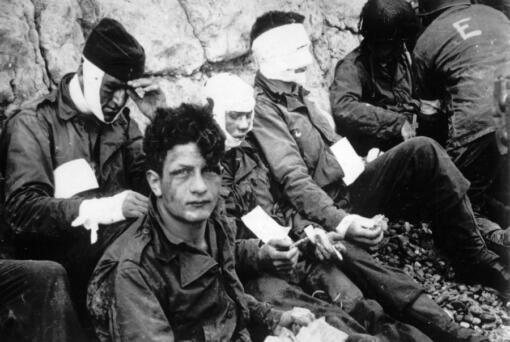 Men of the American assault troops of the 16th Infantry Regiment, injured while storming a coastal area code-named Omaha Beach during the Allied invasion of the Normandy, wait by the chalk cliffs at Collville-sur-Mer for evacuation to a field hospital for further treatment, June 6, 1944. On D-Day, Charles Shay was a 19-year-old Native American army medic who was ready to give his life &mdash; and actually saved many. Now 99, he&rsquo;s spreading a message of peace with tireless dedication as he&rsquo;s about to take part in the 80th celebrations of the landings in Normandy that led to the liberation of France and Europe from Nazi Germany occupation.