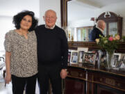Holocaust survivor Herbert Rubinstein and his wife Ruth stand beside photos of their family April 25 in their home in Duesseldorf, Germany. Holocaust survivors from around the globe participating in a new digital campaign called &ldquo;#CancelHate&rdquo; which features videos of them reading Holocaust denial posts from different social media platforms.