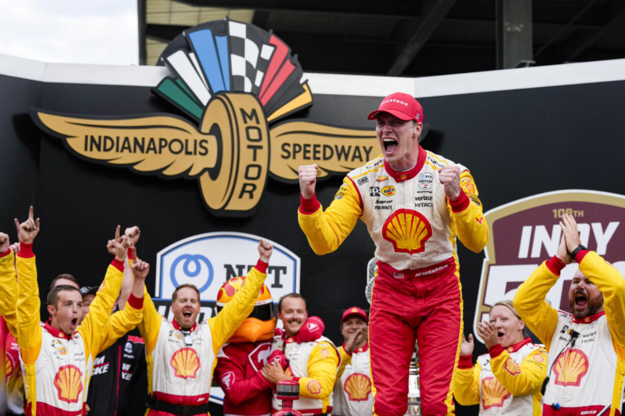 Josef Newgarden celebrates after winning the Indianapolis 500 auto race at Indianapolis Motor Speedway in Indianapolis, Sunday, May 26, 2024.