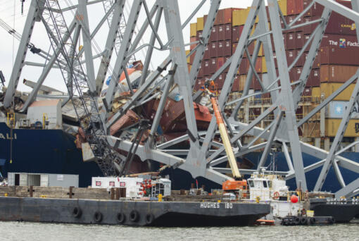 In this photo provided by the U.S. Army Corps of Engineers, salvors with the Unified Command prepare charges for upcoming precision cuts to remove Section 4 from the port side of the bow of the Dali container ship, May 7, 2024, during the Key Bridge Response, in Baltimore. Debris and wreckage removal is ongoing in support of safely and efficiently opening the Fort McHenry Channel, following the Francis Scott Key Bridge&rsquo;s March 26 collapse. (Christopher Rosario/U.S.
