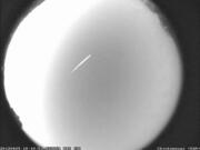 This photo provided by NASA shows an Eta Aquarid meteor streaking over northern Georgia on April 29, 2012. The Eta Aquarid meteor shower peaks this weekend. Astronomers say it should be visible in both hemispheres. (B.