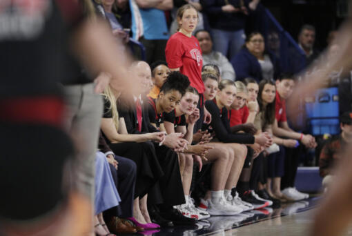 FILE - Players and staff on the Utah bench react toward the end of a second-round college basketball game against Gonzaga in the NCAA Tournament in Spokane, Wash., Monday, March 25, 2024. A northern Idaho prosecutor won&rsquo;t bring hate crime charges against an 18-year-old accused of shouting a racial slur at members of the Utah women&rsquo;s basketball team while the team was in Idaho to attend the NCAA Tournament.