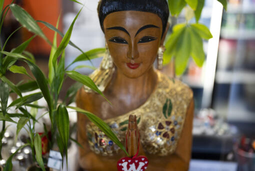 A statue is seen at Chiang Rai Thai Cuisine, a family restaurant run by members of the Iu Mien community, on Tuesday, April 30, 2024, in Troutdale, Ore. There is a sizeable Iu Mien community in Portland and its suburbs, with a Buddhist temple and Baptist church, active social organization, and businesses and restaurants.