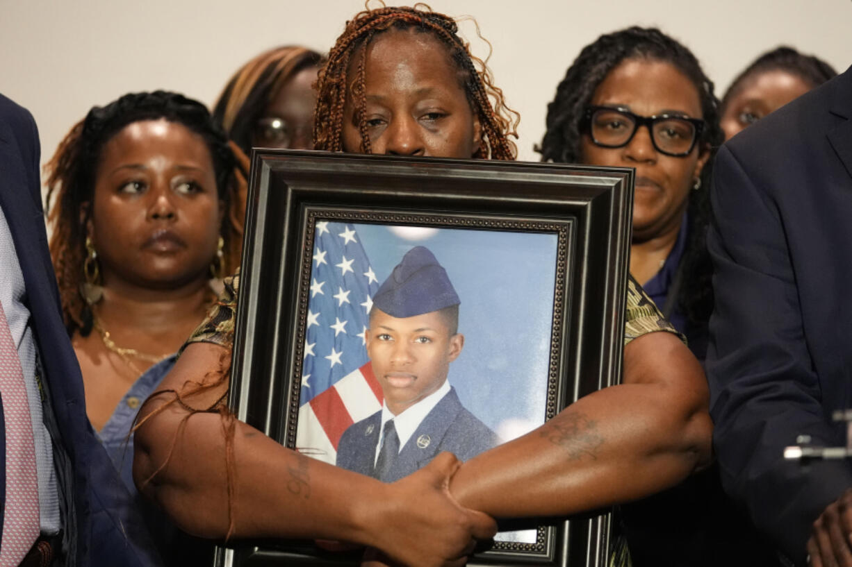 Chantemekki Fortson, mother of Roger Fortson, a U.S. Air Force senior airman, holds a photo of her son during a news conference with attorney Ben Crump, Thursday, May 9, 2024, in Fort Walton Beach, Fla. Fortson was shot and killed by police in his apartment, May 3, 2024.